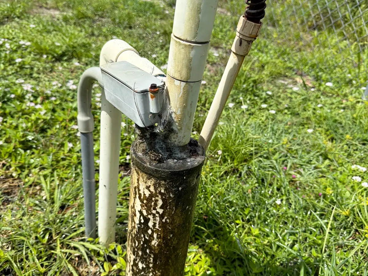 Aging private well head and pressure switch at a Southwest Florida home, a candidate for well water testing